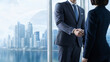 © Ziku - Professional business handshake in modern office, corporate partners closing deal, successful partnership against city skyline background
