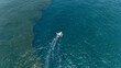 © Amazing Aerial - Aerial view of a motorboat cruising through the blue waters near Tarkwa Bay Beach, leaving a white wake in Lagos, Lagos, Nigeria.