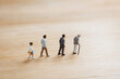 © JP.Studio - AI generated miniature people representing childhood adulthood old age aging progression longevity health span life cycle human development concept