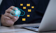 © sarach - Cloud storage backup, document folder transfer, and file management concept with businessman touching glowing cloud icon near floating folders and laptop.