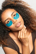 © Gonzalo Infiesta - Young woman applying under eye patches for skincare routine