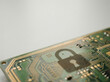© Nakarin - Padlock shadow on green circuit board symbolizes digital security and data protection in technology systems