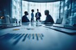 © Fahroni - Business leaders reviewing economic shock projections and financial charts during a strategy meeting in a modern office, assessing market uncertainty to guide crisis management and business decisions