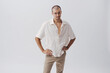 © stokkete - Funny Skeptical Young Man Standing Hands on Hips with Doubtful Expression