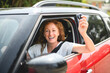 © Louis-Paul Photo - shot of smiling mature woman driving her car in the city.