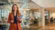 © Bluum - Smiling businesswoman with tablet standing by glass wall with glowing circuit pattern in modern office. Artificial intelligence and digital transformation in corporate business