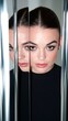 © kvladimirv - Reflection and Symmetry: Woman's Face Mirrored in Vertical Polished Metal Surfaces