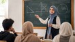 © Aleksandr - Muslim female teacher in hijab explaining geometry and mathematics to students at a chalkboard during a school classroom lesson.