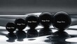 © Mohamad - Five obsidian-black polished spheres of increasing size labeled Stage One to Stage Five, arranged on a reflective silver surface with Progress in motion text and monochrome tones.