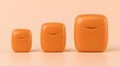 © GUNARTOGRAPHY - Three orange dental floss containers in ascending size order on a plain background.