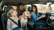 © mila103 - Family smiles as dog sits calmly beside them. Girl laughs joyfully in front of the driver. Parent behind wheel looks happy and relaxed. Dog wears a collar, tail wagging gently