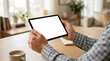 © BrilliantPixels - Close up of a man using a digital tablet computer with an isolated white screen.