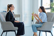 © Valerii Honcharuk - Female psychologist helping upset female client suffering from stress during session