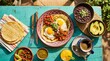 © SatyaB - Vibrant mexican breakfast spread with eggs tortillas and beans