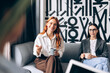 © Maria Vitkovska - Business women discussing during a coffee break in office