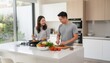 © Punnn - A Couple Prepares a Healthy Meal Together: A young couple happily collaborates in a modern kitchen, chopping fresh vegetables for a nutritious meal.