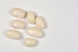 © nahhan - A horizontal studio shot of seven young raw white beans arranged in a small cluster on a clean white background with copy space.