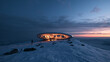 © BlackBridge Media - Futuristic Architectural Pod on Snowy Mountain Peak at Twilight