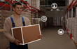© New Africa - Worker with cardboard box in warehouse and virtual icons. Wholesaling digitalization