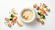 © ArifRus - Delicious cheese fondue served in a white pot with fresh vegetables and bread.