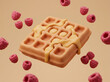 © BIMO - Delicious golden waffle with syrup and fresh raspberries floating in the air.