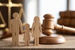 © Generative AI - Wooden family figures stand beside judge gavel and