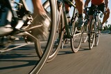 cyclists riding bicycles on sunny road