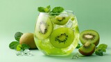 refreshing glass of kiwi mojito with fresh mint leaves and ice cubes on a green background