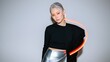 © kvladimirv - Futuristic Fashion: Woman with Silver Hair, Orange Makeup, and Neon Light Effect
