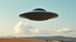 © Dilshan - Metallic unidentified flying saucer hovering over flat agricultural field