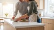 © hani visuals  - Happy couple preparing healthy meal together in a bright modern kitchen at home