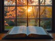 © Valentyna - Open bible rests on a window sill, sunlight streams through the window behind it, illuminating the pages