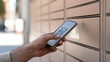 © photo for everything - Person use smart phone device to scan bar code for open secure locker parcel box delivery station in city street public outdoor background