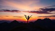 © rohmat - Silhouette of woman practicing yoga on mountain peak.