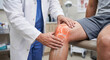 © murni - Doctor Performing Physical Knee Examination and Evaluating Joint Anatomy in a Clinical Setting