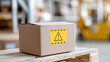 © A2Z AI  - Cardboard box with yellow caution warning sign symbol label on wooden pallet in warehouse logistics distribution center commerce supply chain