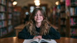 © BlackBridge Media - Smiling Young Girl Reading Book in Library