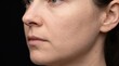 © Faye Visuals - Side Angle Closeup of Caucasian Female Face with Fine Skin Pores Against Black Background