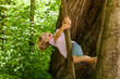© Westend61 - Little boy climbing on a tree