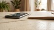© Nusara Visual Studio - Smartphone with online education icons and open notebook on a wooden table for digital learning concept