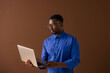 © OchreOchre/Stocksy - Professional Man Working on Laptop in Studio