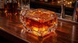 © GoodTake - Elegant crystal whiskey decanter with amber bourbon on a wooden bar counter