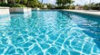 © Said - Clear turquoise pool water crossed by bright sun caustics