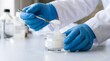 © Jo-El - Close-Up of Gloved Hands Testing Translucent Gel-Cream Texture with Spatula in Laboratory