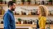 © raja - Man and Woman Having a Serious Conversation in a Well-Stocked Kitchen Pantry with Jars of Food