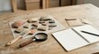 © rezaul4022 - Archaeological excavation tools with pottery shards, magnifying glass, and notebook on wooden desk