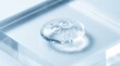 © rezaul4022 - Close up of a clear cosmetic gel drop on a glass surface with bubbles and light reflections