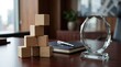 © rezaul4022 - Wooden blocks stacked like a pyramid next to a crystal award on a corporate office desk