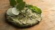 © rezaul4022 - Natural organic facial scrub mask with eucalyptus and mint leaves on a rustic stone background