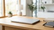 © Spot Decor - A clean wooden desk featuring a laptop and organized stationery supplies for productivity.